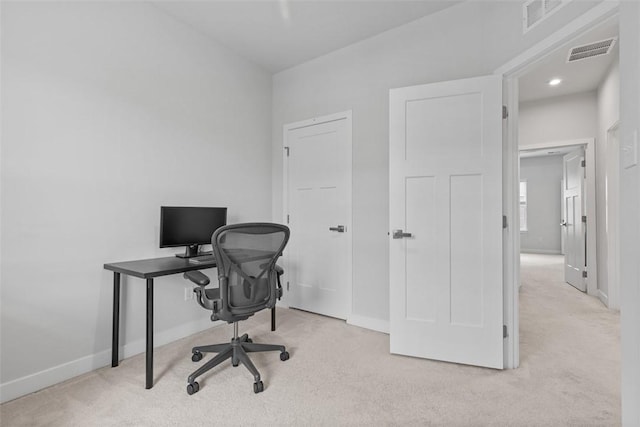 home office with carpet flooring, baseboards, and visible vents