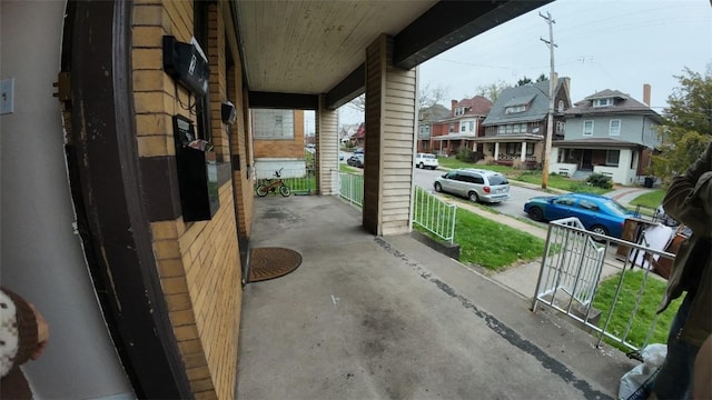 view of patio with a porch and a residential view