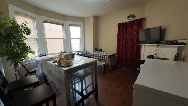 dining room featuring dark wood-style floors