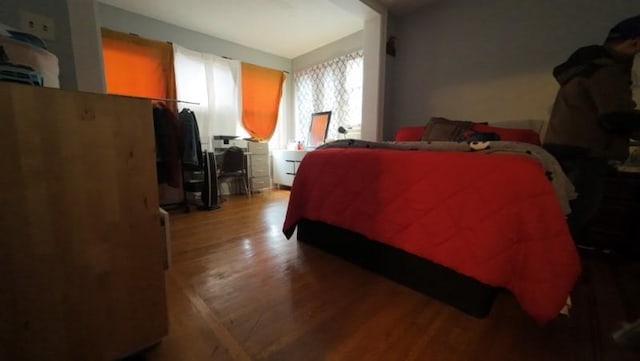 bedroom featuring wood finished floors