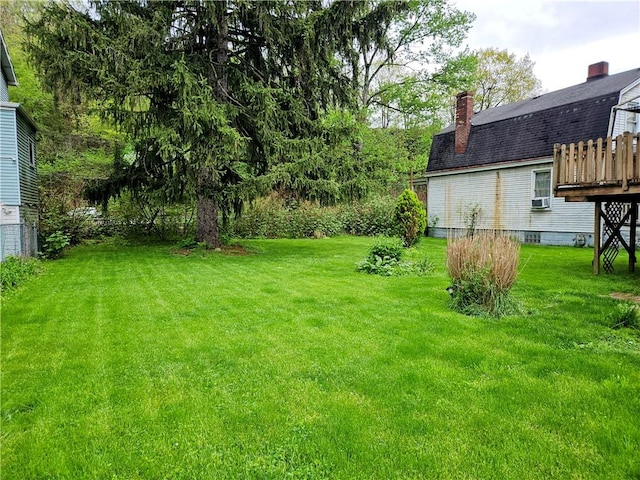 view of yard with a wooden deck