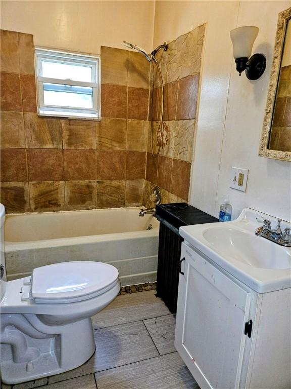 full bathroom with toilet, shower / tub combination, and vanity