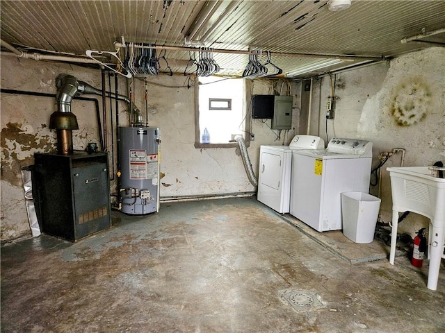 below grade area with washer and dryer, a sink, electric panel, and gas water heater