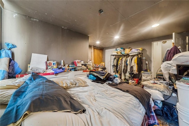 bedroom with a closet and recessed lighting