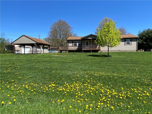 view of yard with a gazebo, a detached carport, and a deck