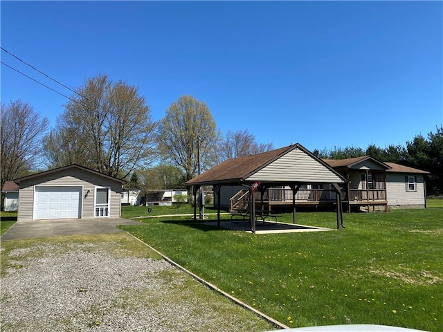 view of yard with an outdoor structure, a gazebo, a garage, and gravel driveway