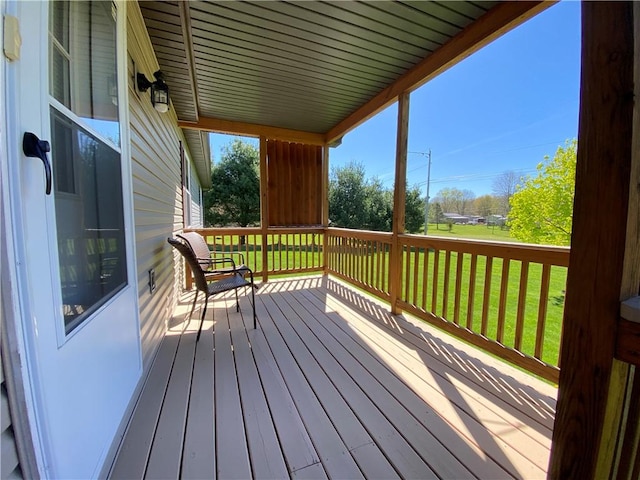 deck featuring a lawn