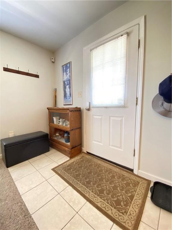 foyer entrance featuring light tile patterned flooring