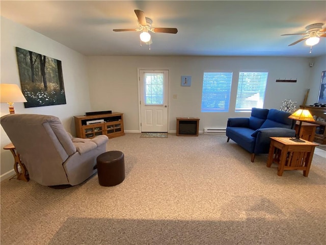 carpeted living area featuring a ceiling fan, baseboards, and a baseboard heating unit