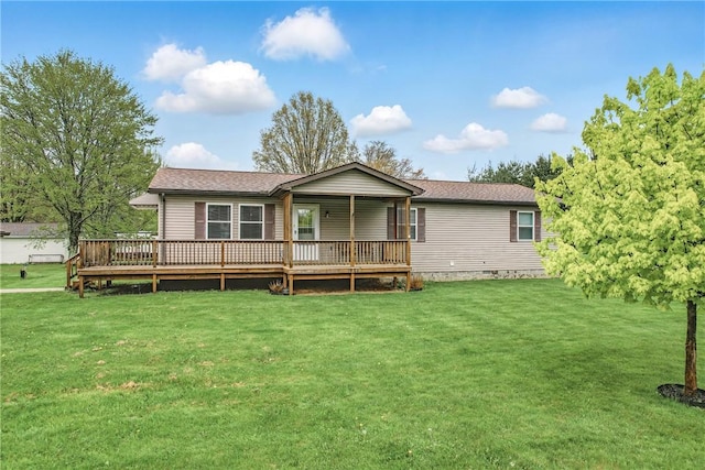rear view of house featuring a yard, a wooden deck, and crawl space