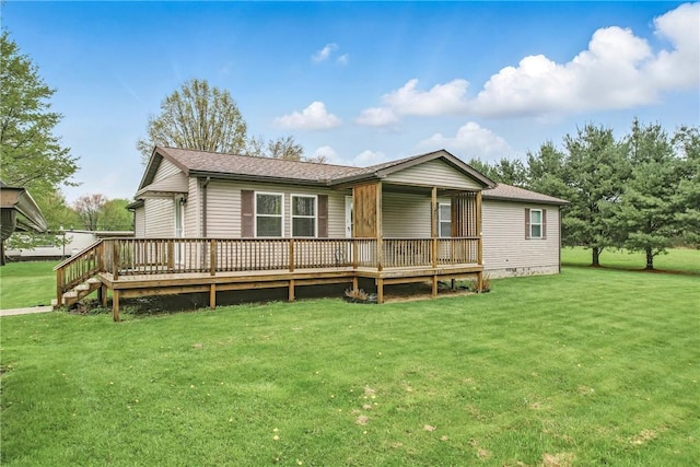 back of property featuring a lawn, a wooden deck, a shingled roof, and crawl space