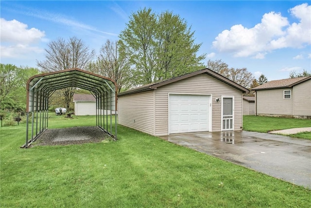 detached garage featuring a detached carport and concrete driveway