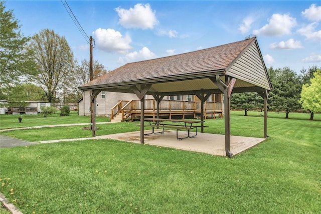 view of home's community with a gazebo, a patio area, a wooden deck, and a lawn