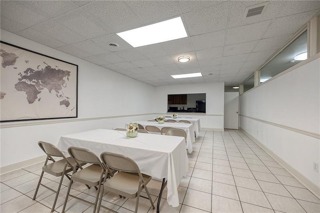 5 Bayard Unit 309, Shadyside, PA 15213 - dining space with light tile patterned flooring, baseboards, visible vents, and a drop ceiling