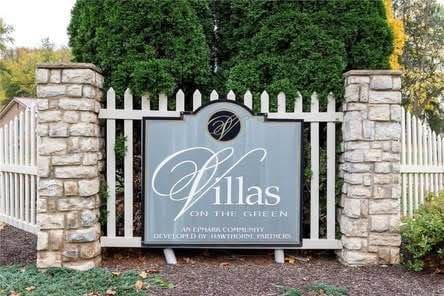 community sign with fence