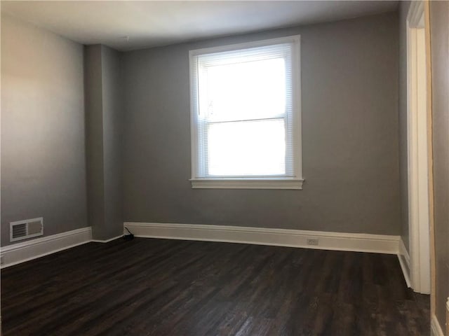 617 Center Ave, West View, PA 15229 - spare room featuring visible vents, baseboards, and dark wood-type flooring