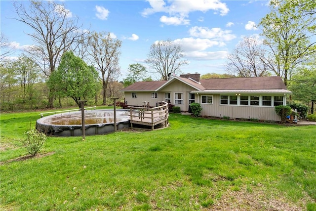 78 Cherryhill Rd, Indiana Boro Ind, PA 15701 - rear view of house featuring a deck, a chimney, and a lawn