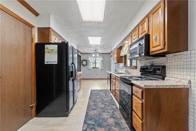 78 Cherryhill Rd, Indiana Boro Ind, PA 15701 - kitchen with a sink, tasteful backsplash, black appliances, light countertops, and light wood-style floors