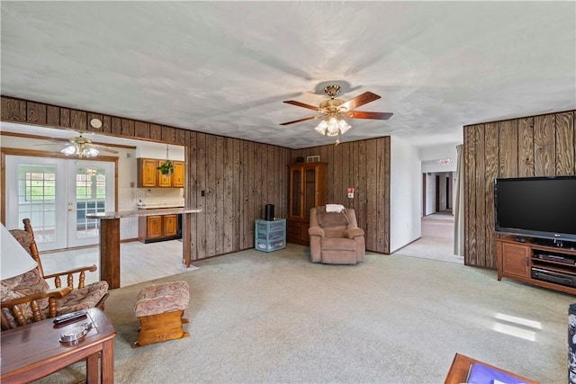 78 Cherryhill Rd, Indiana Boro Ind, PA 15701 - living area featuring wooden walls, ceiling fan, and light colored carpet