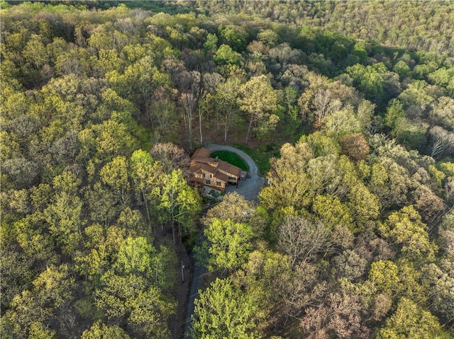 birds eye view of property with a view of trees