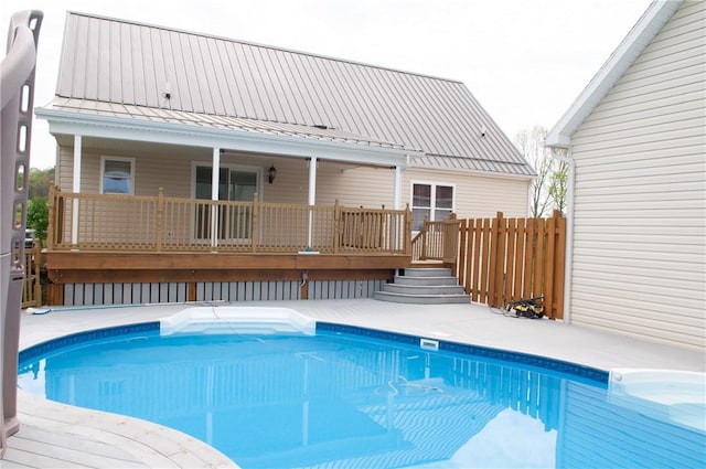 view of swimming pool with a deck and a fenced in pool