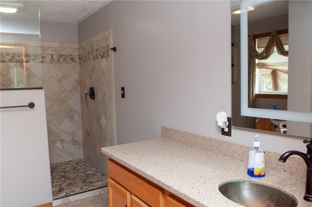 bathroom featuring vanity and a walk in shower