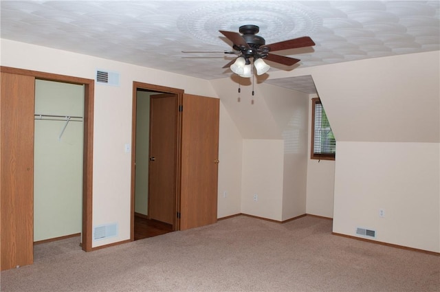 additional living space featuring ceiling fan, carpet, baseboards, and visible vents