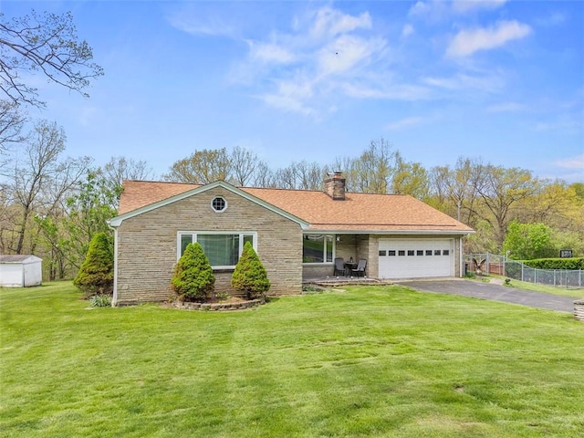 110 Thorncrest Dr, Penn Twp But, PA 16002 - single story home with an attached garage, a chimney, fence, aphalt driveway, and a front lawn
