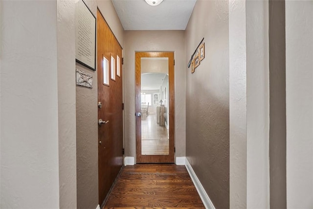 110 Thorncrest Dr, Penn Twp But, PA 16002 - doorway to outside with dark wood-style flooring, baseboards, arched walkways, and a textured wall