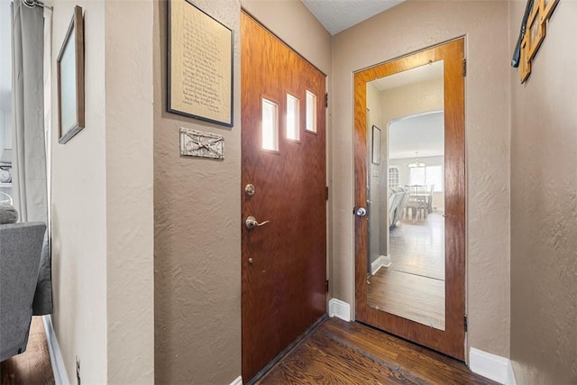 110 Thorncrest Dr, Penn Twp But, PA 16002 - doorway to outside featuring a textured wall, a healthy amount of sunlight, and wood finished floors