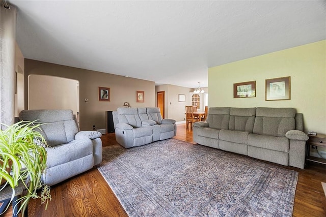 110 Thorncrest Dr, Penn Twp But, PA 16002 - living area featuring arched walkways, a chandelier, and wood finished floors