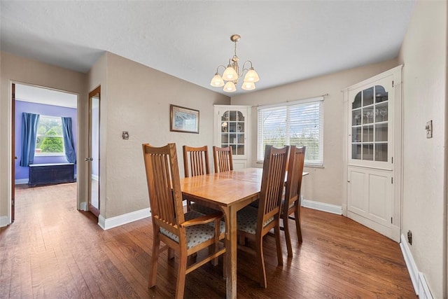 110 Thorncrest Dr, Penn Twp But, PA 16002 - dining area with an inviting chandelier, wood finished floors, and baseboards