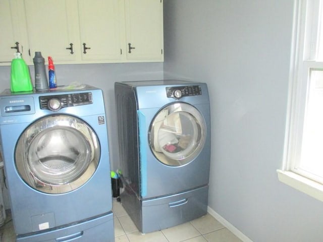400 12th St, New Brighton, PA 15066 - laundry room featuring light tile patterned floors, baseboards, independent washer and dryer, and cabinet space