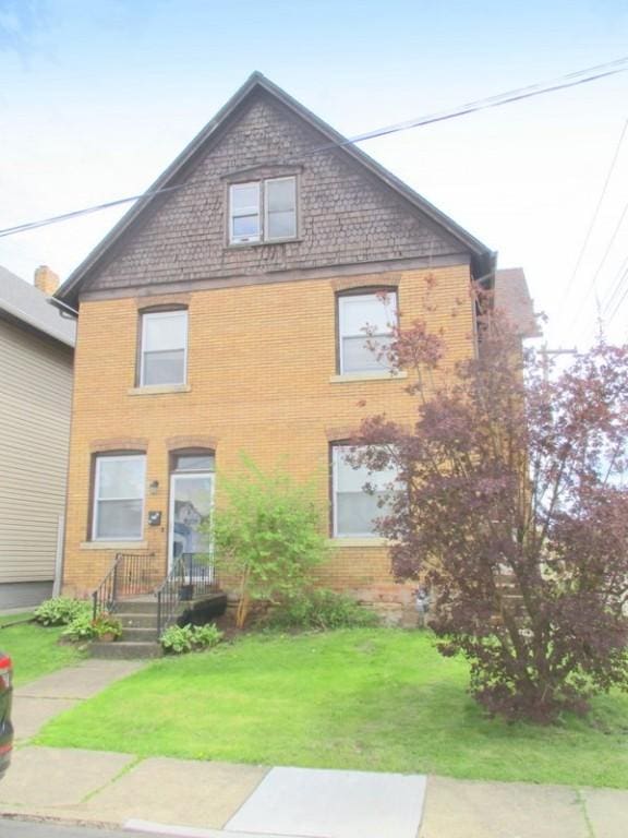 400 12th St, New Brighton, PA 15066 - view of front of home with a front yard and brick siding