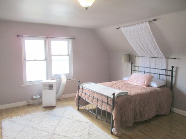 400 12th St, New Brighton, PA 15066 - bedroom featuring vaulted ceiling, baseboards, and wood finished floors
