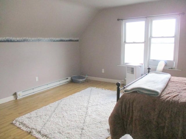 400 12th St, New Brighton, PA 15066 - bedroom featuring lofted ceiling, baseboards, baseboard heating, and wood finished floors