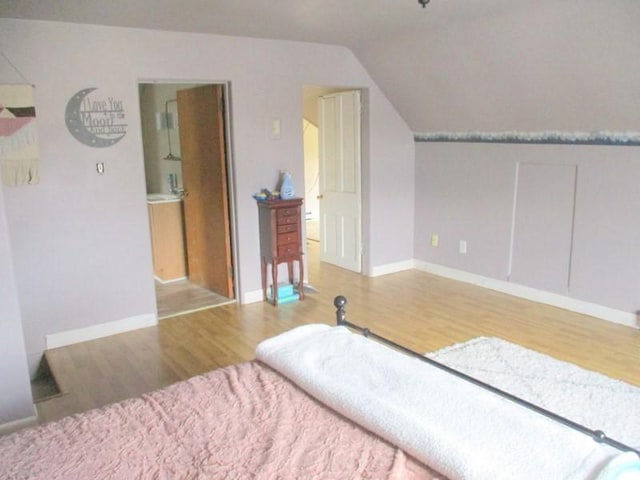 400 12th St, New Brighton, PA 15066 - bedroom with baseboards, wood finished floors, and lofted ceiling