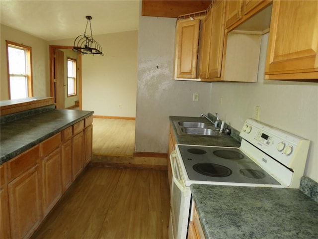595 Amity Ridge Rd, Amwell, PA 15311 - kitchen with white electric range oven, wood finished floors, dark countertops, and pendant lighting