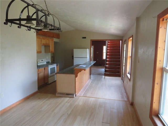 595 Amity Ridge Rd, Amwell, PA 15311 - kitchen featuring white appliances, light wood-type flooring, plenty of natural light, and vaulted ceiling