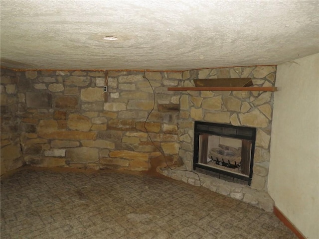 595 Amity Ridge Rd, Amwell, PA 15311 - unfurnished living room with a fireplace, a textured ceiling, and carpet