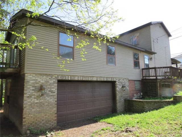 595 Amity Ridge Rd, Amwell, PA 15311 - back of house with brick siding, a garage, and a wooden deck