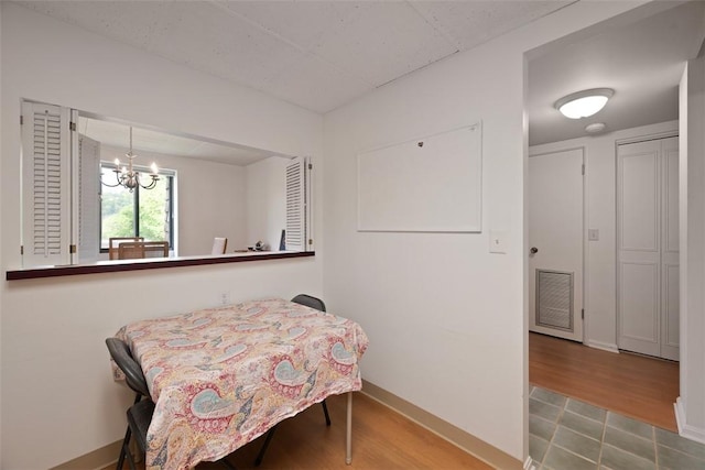72 Linden Pl Unit 22, Sewickley, PA 15143 - dining room featuring baseboards, a notable chandelier, visible vents, and wood finished floors