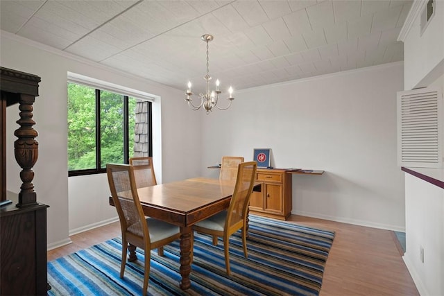 72 Linden Pl Unit 22, Sewickley, PA 15143 - dining area featuring a notable chandelier, baseboards, ornamental molding, visible vents, and wood finished floors