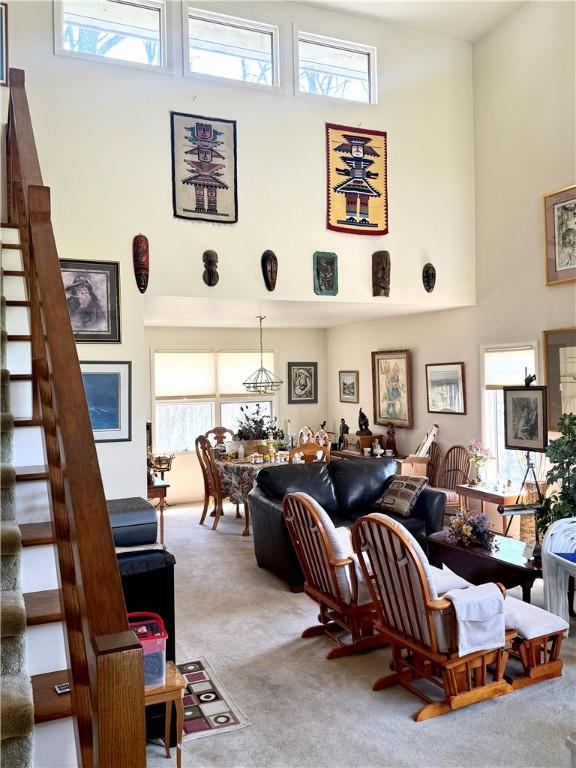 420 Edgewood Ave, White Twp Ind, PA 15701 - carpeted living area featuring stairway and a high ceiling