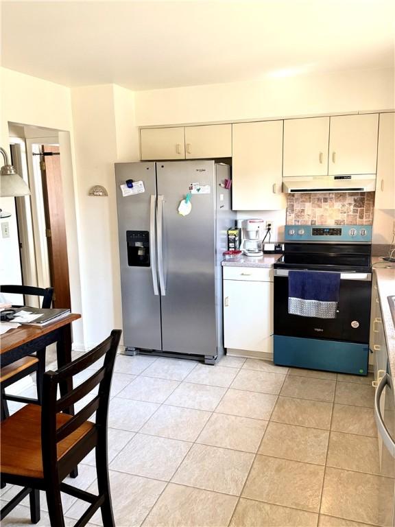 420 Edgewood Ave, White Twp Ind, PA 15701 - kitchen with light tile patterned floors, light countertops, stainless steel appliances, and under cabinet range hood