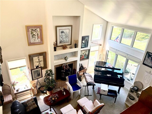 420 Edgewood Ave, White Twp Ind, PA 15701 - carpeted living room with a tile fireplace and high vaulted ceiling