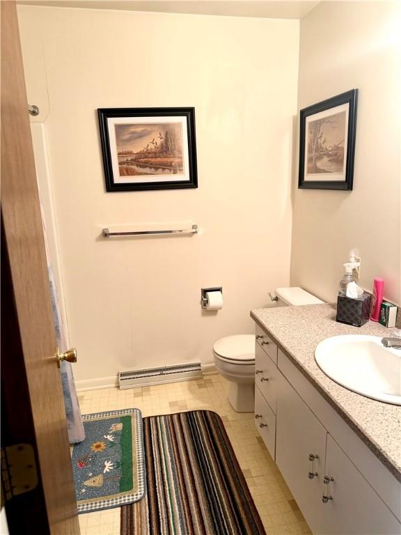 420 Edgewood Ave, White Twp Ind, PA 15701 - bathroom featuring a baseboard heating unit, vanity, and toilet