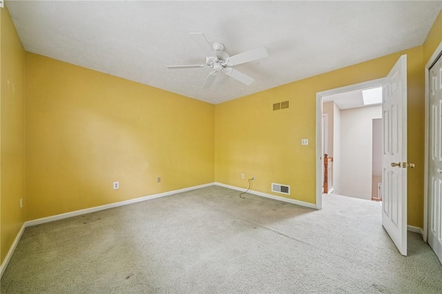 unfurnished room with carpet, ceiling fan, and baseboards
