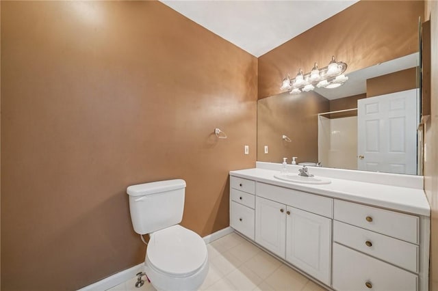bathroom with baseboards, toilet, vanity, and a shower