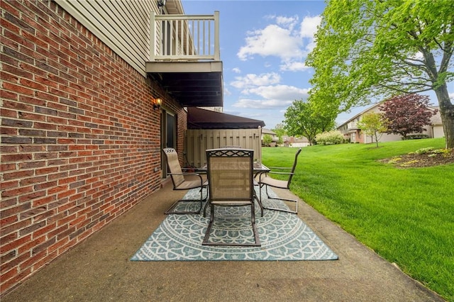 view of patio / terrace featuring outdoor dining space and a balcony